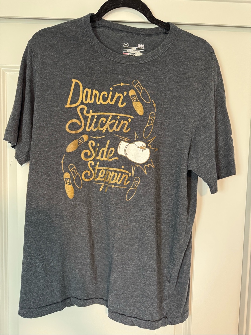 Under Armour Muhammad Ali Charcoal Short-Sleeve Tee with Gold and White Graphic
